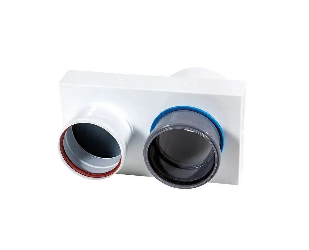Brötje Adapter mit zwei unterschiedlichen Anschlüssen. Ein weißer Kasten mit runden Öffnungen, eine silberne und eine graue, für flexible Installationen.