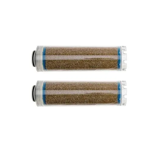 Zwei durchsichtige Wasseraufbereitungskartuschen von Brötje mit einem feinen, braunen Filtermaterial sichtbar im Inneren der Kartuschen.