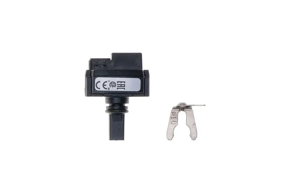 Drucksensor von Brötje mit schwarzem Gehäuse und einem Anschluss, daneben ein metallischer Kontakt.