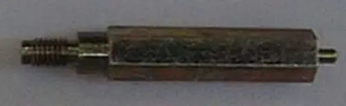 Brötje Zubehörteil, rechteckiger metallischer Induktivitätskasten mit zwei Anschlüssen, einem gewinde- und einem stiftförmigen Ende.